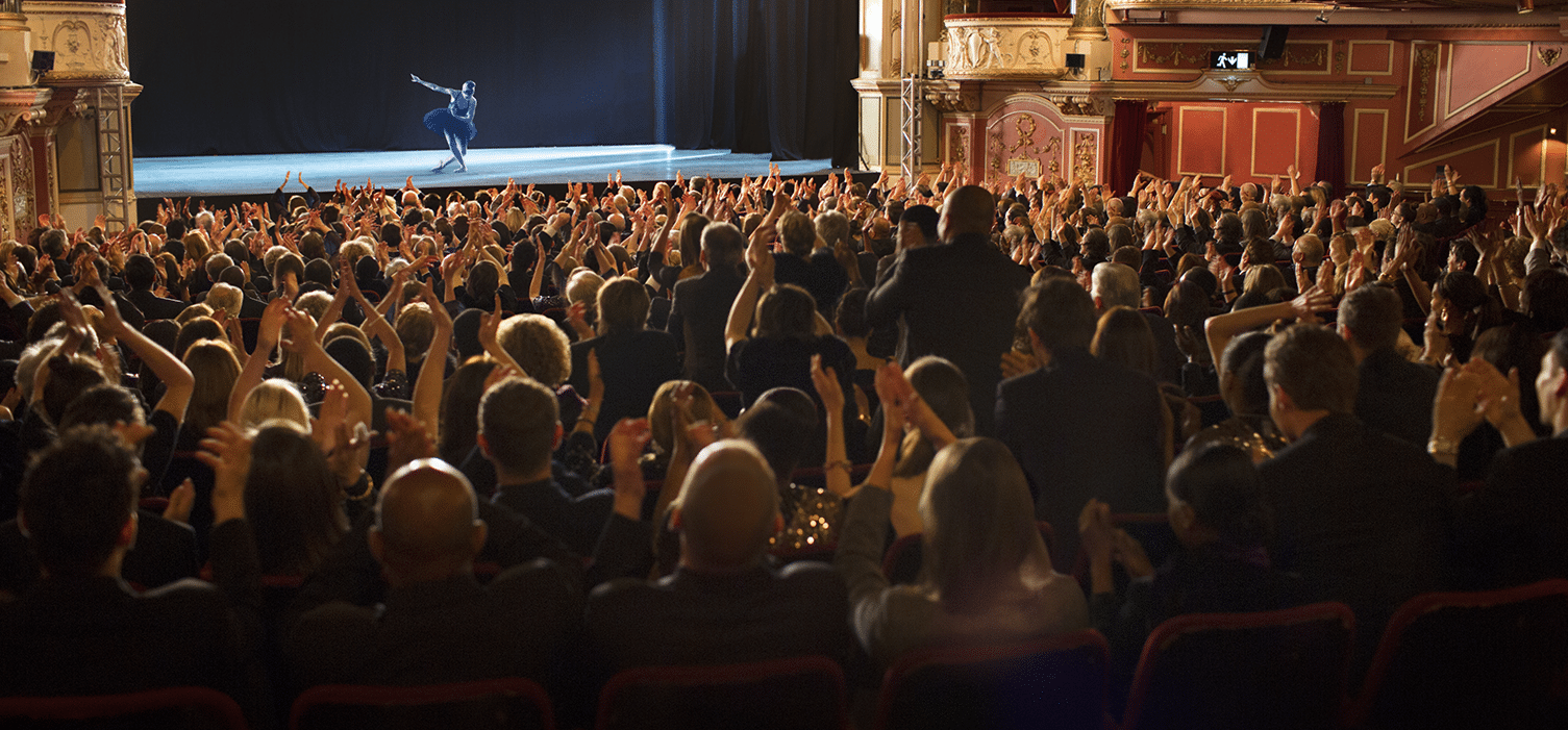 Theatre audience clapping hands