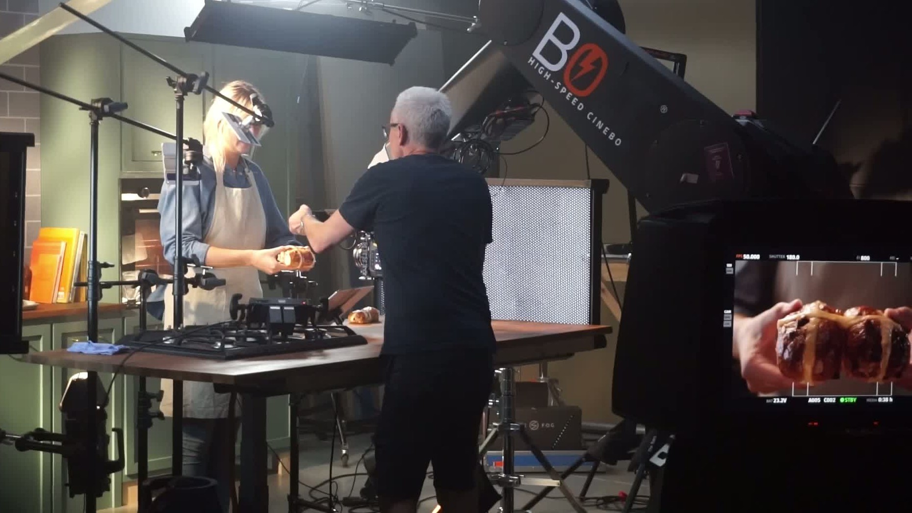 The Bolt filming a woman baking bread while a director directs the scene