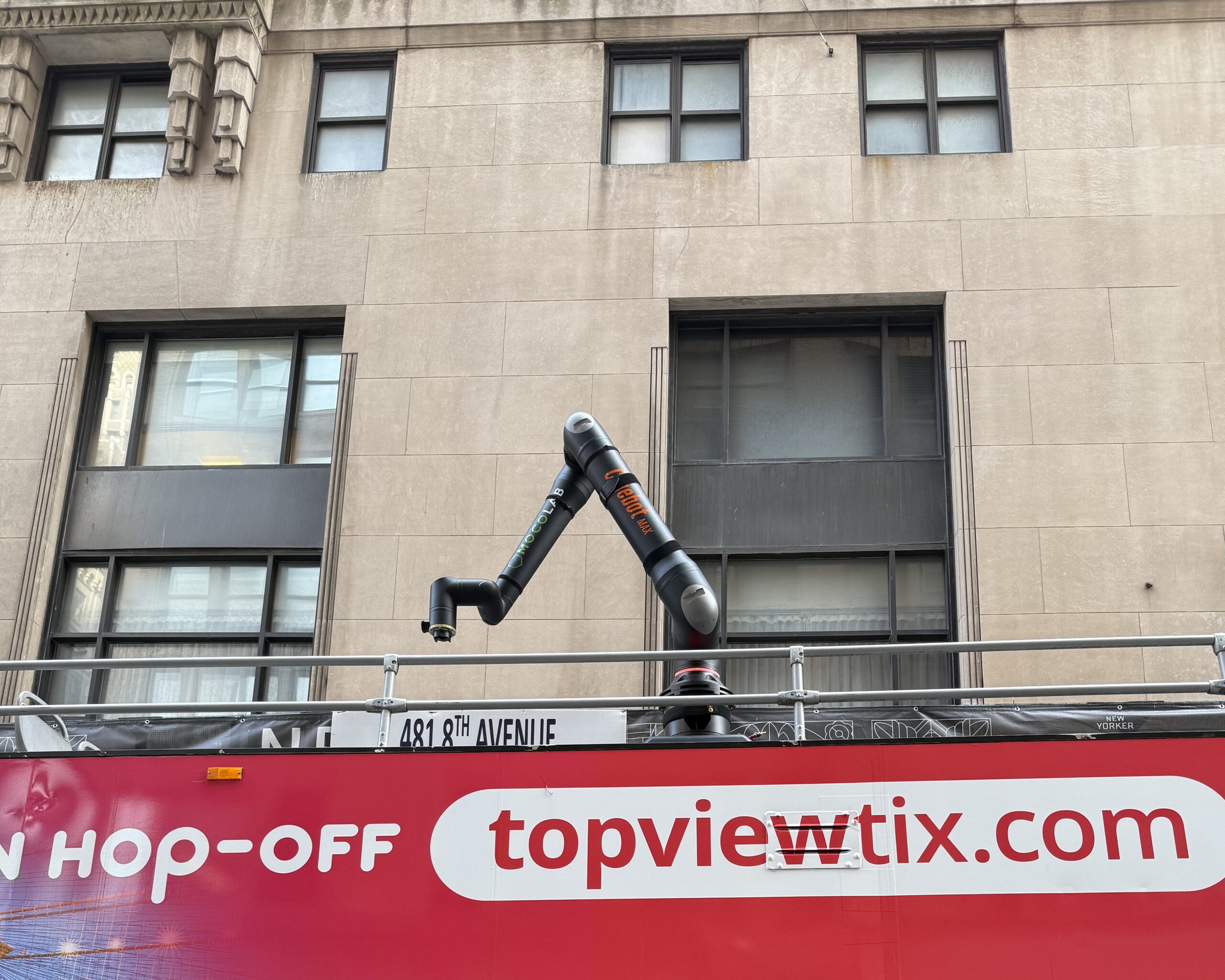 Cinebot Max Robot on top of bus